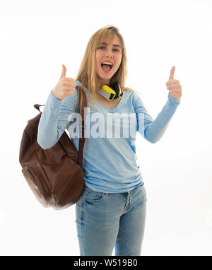 Portrait of attractive blonde student teenager girl making thumbs up gesture feeling successful and happy against white background In people, Educatio Stock Photo