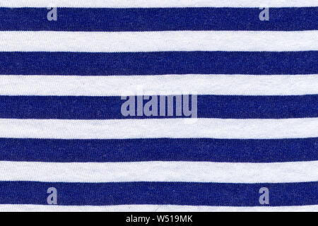 Texture of real knitwear in blue and white stripes, textile background. Sea theme. Stock Photo