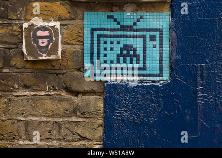 A mosaic by ’Invader’ well-known French street artist, whose street mosaics are modelled on the crude pixellation of 1970s–1980s video games. He took Stock Photo