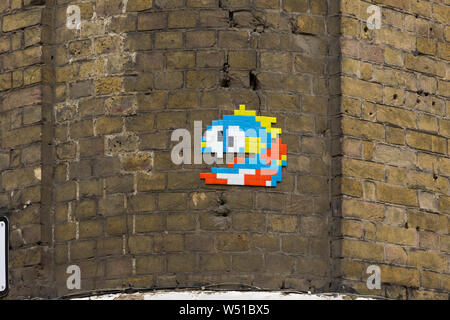 A mosaic by ’Invader’ well-known French street artist, whose street mosaics are modelled on the crude pixellation of 1970s–1980s video games. He took Stock Photo