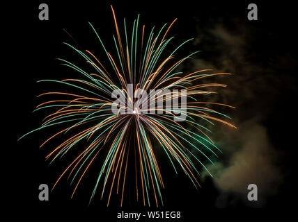 Beautiful multicolored fireworks against a night sky during a festive celebration Stock Photo