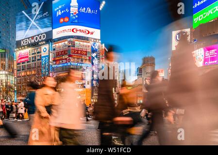 Shibuya Crossing, crowds of people at crossroads, colorful signs and neon signs at the skyscrapers, dusk twilight, Shibuya, Udagawacho, Tokyo, Japan Stock Photo