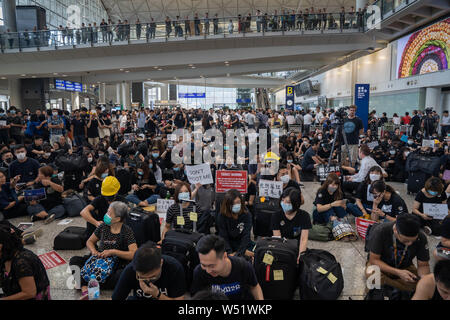 Hundreds of anti government protesters staged a sit in protest at the Hong Kong international airport terminal, the first of three straight days of demonstrations after clashes last week triggered fears that a wider confrontation could erupt in the city. Stock Photo