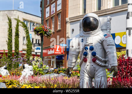 Alien landscape with American astronauts landing on the Moon theme community garden in the middle of town in North West of England. Stock Photo