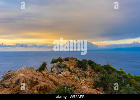 Greece, Zakynthos, Mediterranean colorful sunset sky over endless blue ocean on a mountain Stock Photo