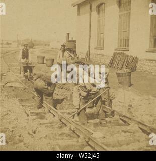 Men laying down train tracks, Unknown, about 1860, Albumen silver print Stock Photo