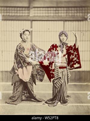Two Japanese Women in Costume, Unknown, Japan, 1890s, Hand-colored albumen silver print, 26 x 20.5 cm (10 1/4 x 8 1/16 in Stock Photo
