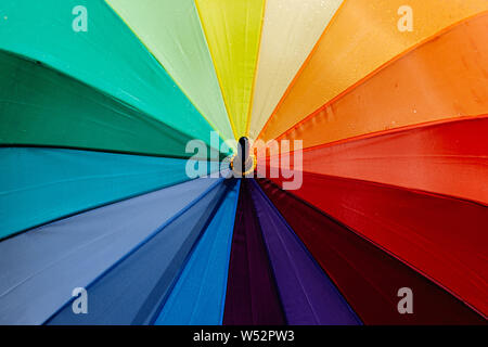 Umbrella with rainbow colors. Colorful background. LGBT Stock Photo