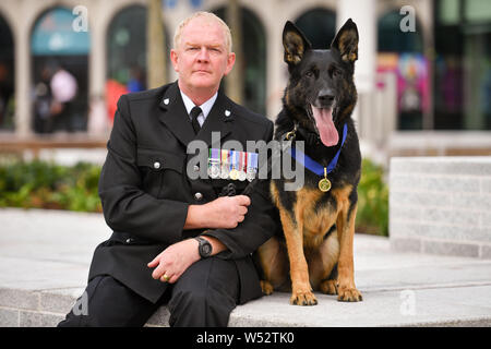 Retired West Mercia Police dog handler PC Mike Davey and retired police ...