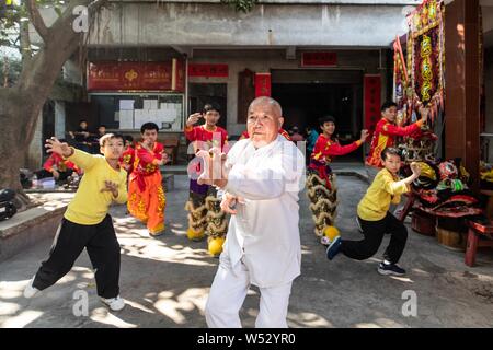 Apprentices of Pang Zhaosheng practice Kung Fu forms at the Lion Dance master's training center in Foshan city, south China's Guangdong province, 24 J Stock Photo