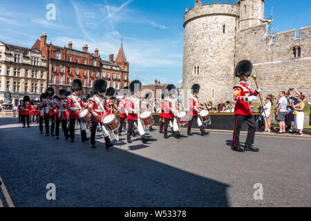 Changing of the guard ceremony as the soldiers of the new guard parade into Windsor Castle to relieve the old guard. Stock Photo