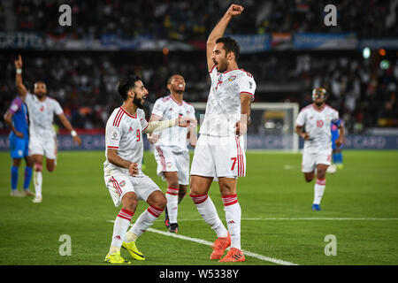 Ali Mabkhout, top, of United Arab Emirates national football team celebrates after scoring against India national football team in the AFC Asian Cup G Stock Photo