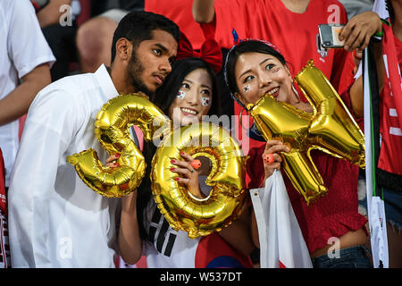 South Korean football fans show support for South Korea national football team in the round of 16 match between South Korea and Bahrain during the 201 Stock Photo