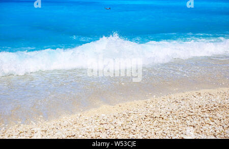Waves on the famous Myrtos beach on the island of Kefalonia, one of the most beautiful beaches in Greece. Stock Photo