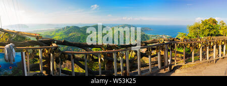 Beautiful panorama landscape view of turquoise ocean waves with boats, coastline and blue sky background from high aerial view point of Kata Stock Photo
