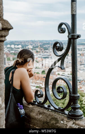 A young woman at Cabot Tower in Brandon Hill Park in Bristol, South West England Stock Photo