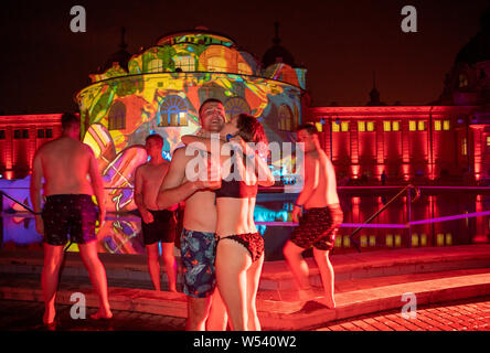 Hundreds of revellers partying at Szechenyi thermal baths in Budapest.The 109-year-old spa is taken over by revellers every Saturday night from Februa Stock Photo