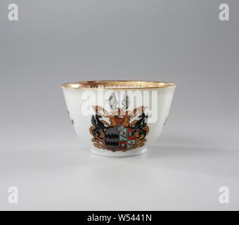 Bell-shaped cup with the arms of the Van Reede from Oudtshoorn and Boesses family, Bell-shaped porcelain cup painted on the glaze in blue, red, pink, green, yellow, tuquoise, black gold. On the outer wall the coat of arms of the Van Reede van Oudtshoorn and Boesses families. In the center the weapon whose shield is divided in two. On the left the arms of Van Reede van Oudtshoorn in gray, on the right the arms of Boesses in red and blue. There is a griffin on either side of the weapon. The helmet sign consists of a crown and wings. On the wall loose flower branches in European style and on Stock Photo