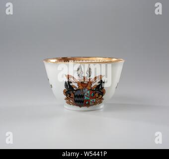 Bell-shaped cup and spoon with the arms of the Van Reede from Oudtshoorn and Boesses family, Bell-shaped porcelain cup and pattipan, painted on the glaze in blue, red, pink, green, yellow, tuquoise, black and gold. On the outer wall the coat of arms of the Van Reede van Oudtshoorn and Boesses families. In the center the weapon whose shield is divided in two. On the left the coat of arms of Van Reede van Oudtshoorn in gray, on the right the coat of arms of Boesses in red and blue. There is a griffin on either side of the weapon. The helmet sign consists of a crown and wings. On the wall loose Stock Photo