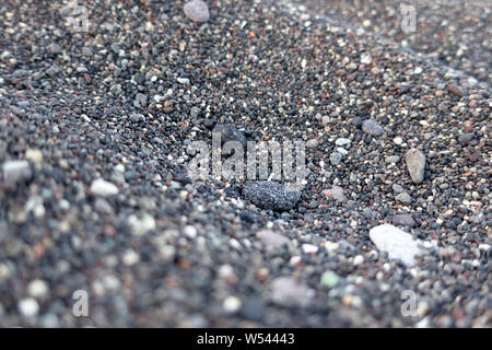 Macro view and detail on Black volcanic sand from Santorini, Greece Stock Photo