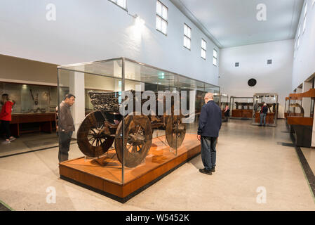 Viking Museum Oslo, view of visitors to the Viking Ship Museum in Oslo looking at a wooden cart discovered in the Oseberg ship, Norway. Stock Photo