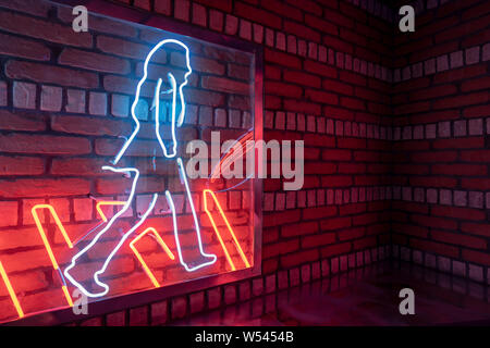 Walking Man made from Neon Lights Stock Photo