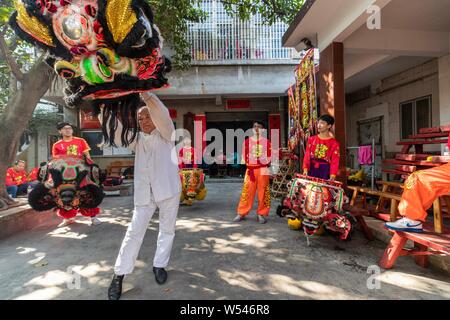 Apprentices of Pang Zhaosheng practice Kung Fu forms at the Lion Dance master's training center in Foshan city, south China's Guangdong province, 24 J Stock Photo