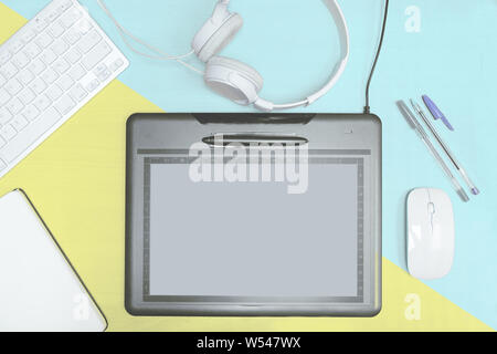 Graphics tablet with a pen tablet in a digital artist and designer office. Top view shot and overhead view with empty copy space for Editor's text. Stock Photo