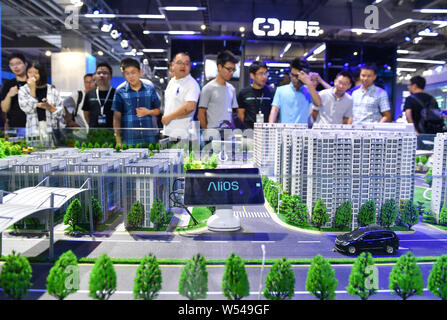 --FILE--People visit the stand of Alibaba Cloud, or Aliyun.com, the online cloud computing unit of Alibaba Group, during the Computing Conference 2018 Stock Photo