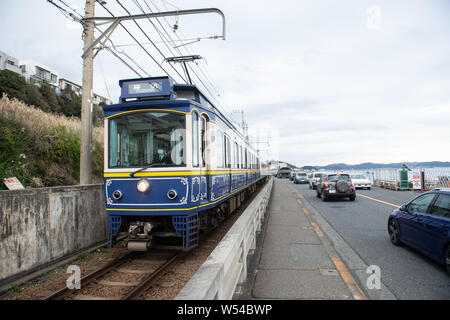 A train on the Enoden Line enters the Kamakura-Koko-Mae Station by the ...