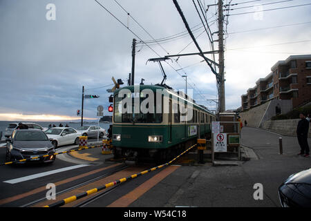 A train on the Enoden Line enters the Kamakura-Koko-Mae Station by the ...