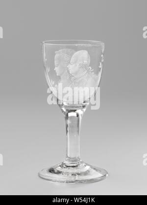 Wine glass with portraits of William V and Wilhelmina or Prussia Chalice with portraits of William V and Princess Wilhelmina of Prussia, Conical foot. Straight trunk, becoming a slightly curved chalice. A double portrait of Stadholder Prince William V (1748-1806) and his wife Princess Wilhelmina of Prussia (1751-1820), bounded on both sides by a branch of orange apples, tied in the middle by a bow, historical persons - BB - woman, historical persons, Willem V (Prince of Orange-Nassau), Wilhelmina of Prussia (1751-1820), anonymous, c. 1790, glass, glassblowing, h 14.8 cm × d 7.9 cm d 7.9 cm Stock Photo