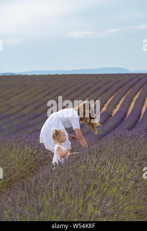 Valensole, France. Mother with daughter in lavender field Stock Photo