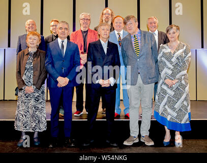 Sir Paul McCartney and his L.I.P.A companions for 2019, (back row left to right) Steve Lewis, Tom Pye, Mark Featherstone-witty, Andrew Scheps, Mike Batt and Cliff Cooper. (front row left to right) Sue Gill, Rowan Atkinson, Sir Paul McCartney, Stephen Fry and Lucy Carter at the annual graduation ceremony for the Liverpool Institute of Performing Arts (LIPA) at Liverpool philharmonic Hall. Stock Photo