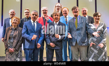 Sir Paul McCartney and his L.I.P.A companions for 2019, (back row left to right) Steve Lewis, Tom Pye, Mark Featherstone-witty, Andrew Scheps, Mike Batt and Cliff Cooper. (front row left to right) Sue Gill, Rowan Atkinson, Sir Paul McCartney, Stephen Fry and Lucy Carter at the annual graduation ceremony for the Liverpool Institute of Performing Arts (LIPA) at Liverpool philharmonic Hall. Stock Photo