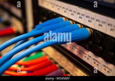 Closeup of BNC SDI signal cables plugged on path panel,select focus Stock Photo