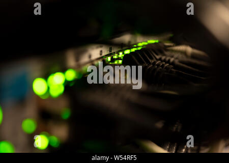 Network Switch and Ethernet Cables Patched into Local Network and IPTV Stock Photo