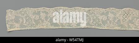 Strip of bobbin lace with decorative bands and hanging carnation, Strip of natural-colored bobbin lace, Binche lace. The repeating pattern consists of decorative bands that create two different lobed fields. In one field there is a loose, curved branch, with a large hanging carnation, two upward-facing rosette flowers and a bunch of five berries. In the other field, from a halved fan-shaped flower, a calyx flower hangs down the top of a curved stalk. The motifs are connected by a lattice ground, a five-hole ground. The motifs are made in linen with cutouts and openwork edges. Two different Stock Photo