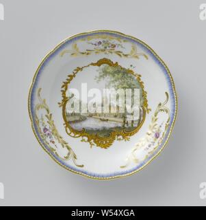 Seven plates from the service of Stadtholder William v, Dish from the Stadtholder Service, with a view of Abcoude, Dish from the stadholder's service, multicolored painted with a face on Abcoude, Round dish from painted porcelain. The border is scalloped and has three cartouches embossed with gold, including a multi-colored flower garland. A blue, ribbed piping runs along the edge. The mirror is painted with a rocaille cartouche with a topographic face inside, described on the back as 'Abcoude aan de Vegt'. The scale is marked., Meissener Porzellan Manufaktur, Meissen, c. 1772 - c. 1774 Stock Photo