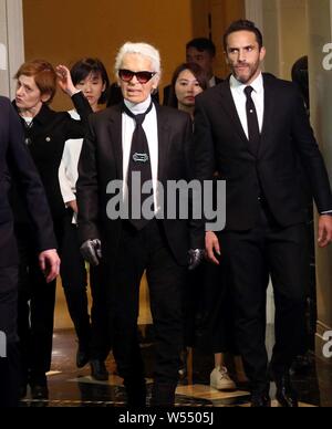 --FILE--German fashion designer Karl Lagerfeld, center, attends the 2016 Digital Fashion Grand Ceremony in Shanghai, China, 19 December 2016.     Karl Stock Photo