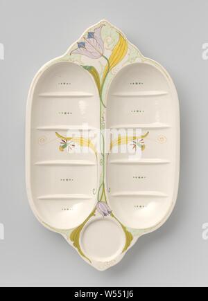 Bowl, divided into compartments, decorated with an open and a closed tulip, Bowl of earthenware, consisting of two long oval side-by-side trays on six supports. The oval trays are divided into five sections by ribs. Between the trays at one end there is a round recessed portion, on the other side a scalloped flat portion, which is decorated with an open tulip on a long stem that runs between the trays and shows a closed tulip at the other end. In the middle of the bins, a yellow leaf with a (flowered) flower. The colors are yellow, light and dark green, red, purple and blue., N.V