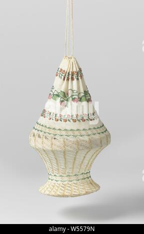 Reticule, in a round basket shape, of ecru-colored cotton with knitted multicolored beads in a pattern of floral vines and stripes, of ecru-colored cotton with knitted multicolored beads. The pattern at the top consists of four horizontal bands, two of which are red flower vines, with a border of green leaves and strawberries (or raspberries) in between and a band of two green rows of beads, with yellow dots in between. The center of the reticle is reinforced with a hard, round hoop. The knit is from here partially worked up diagonally between horizontal stripes of yellow beads, which change Stock Photo