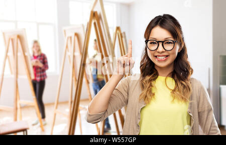 asian woman in glasses or student with finger up Stock Photo