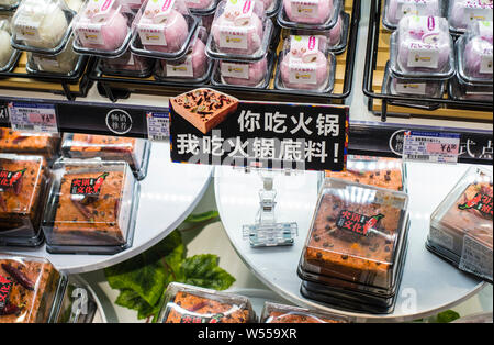 Cakes featuring the shape of piquant chafing dish seasoning of hotpot are for sale in Chengdu city, southwest China's Sichuan province, 3 February 201 Stock Photo