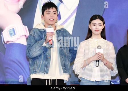 Chinese actress Jelly Lin Yun, right, and Taiwanese actor Darren Wang attend a road show for the new movie 'It Started with a Kiss' in Shanghai, China