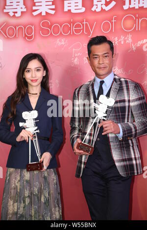 Hong Kong actress Angelababy, left, and Hong Kong actor Louis Koo attend a press conference for the 38th Hong Kong Film Awards in Hong Kong, China, 12 Stock Photo