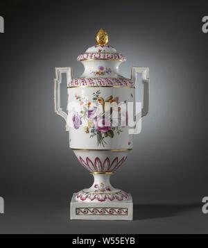 Covered vase with birds on a branch and bouquets, Porcelain covered vase on a spreading base ending in a square pedestal and with a cylindrical body with a round shoulder and narrowing towards the foot. Spreading neck with a flat edge and high, angular ears. Painted on the glaze in blue, red, pink, green, yellow, purple, black and gold. On the belly two birds on a branch in a landscape and a bouquet of different flowers. In between scattered flowers and insects. The narrowing part to the foot with a band with modeled raised leaf motifs in relief. The shoulder and the foot with the same Stock Photo