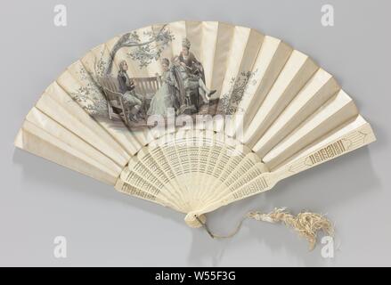 Folding fan with a performance after the painting 'Le prétendu' by Prosper-Etienne Berne-Bellecour, Folding fan with double leaf with an elegant aquatint color scene on the satin front - after the painting 'Le prétendu' by Prosper-Etienne Berne-Bellecour - depicting a young couple in Empire clothing together with an older couple dressed in fashion from 1780, on a leg frame machined with geometric decorations. A soldier sits on a wooden garden bench holding up woolen threads around both hands, while a woman sitting next to him on the bench spins a ball of it. To her right, an older man (her Stock Photo