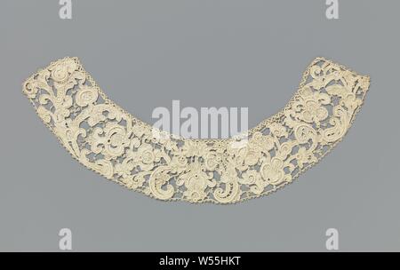 Collar of needle lace with flowers and c-volutes, Collar of natural colored needle lace: Venetian embossed lace. Curved strip-shaped model. The pattern consists in the middle of a more or less symmetrical composition with a flower that is flanked by c-volutes. The remaining pattern, with mainly flowers, some leaves and stems, is not symmetrical. The motifs are made with festoon stitches and feature relief contours and thick cordons decorated with picots. The upper side is finished with a clasped band. The collar is finished with a curved edge along the short sides and bottom. It is possible a Stock Photo