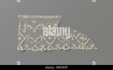 Spool lace frill with diamond-shaped medallions, Natural spool lace frill: Parisian lace. The ground is divided in two into a Parisian ground with clovers at the top and a lawn underneath. In the latter there is a symmetrical pattern of diamond-shaped openwork medallions with side vines topped by a flower between two leaves. The leaves, the side vines and a series of flowers and tendrils in the scallop edge stand loose in three closed streamers. The motifs are made in linen and provided with contour threads. A rose soil was used as an ornamental soil. A portion of the top has been cut off Stock Photo